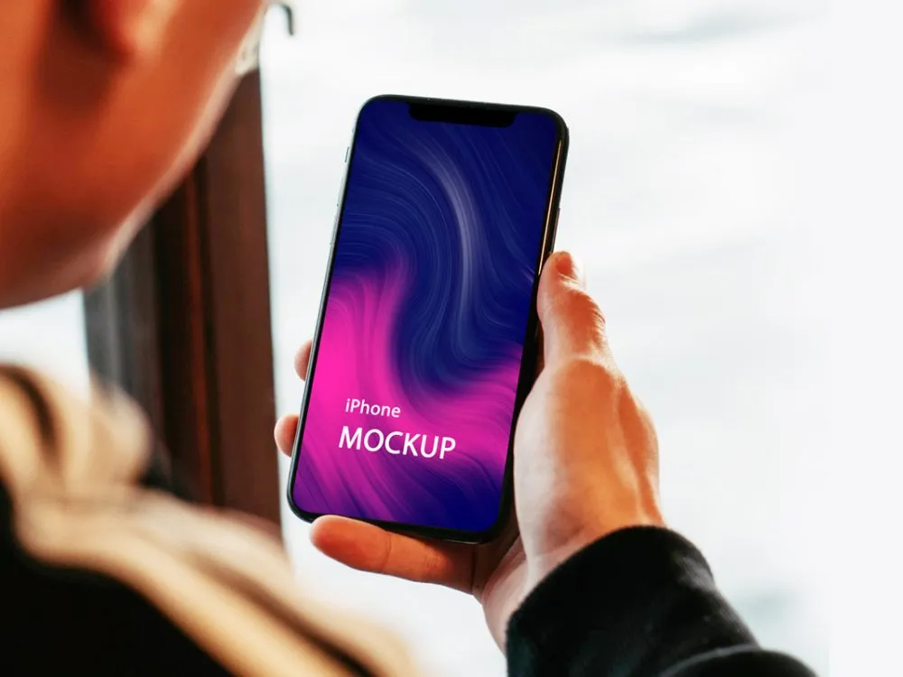 Holding an iPhone Mockup Free Download