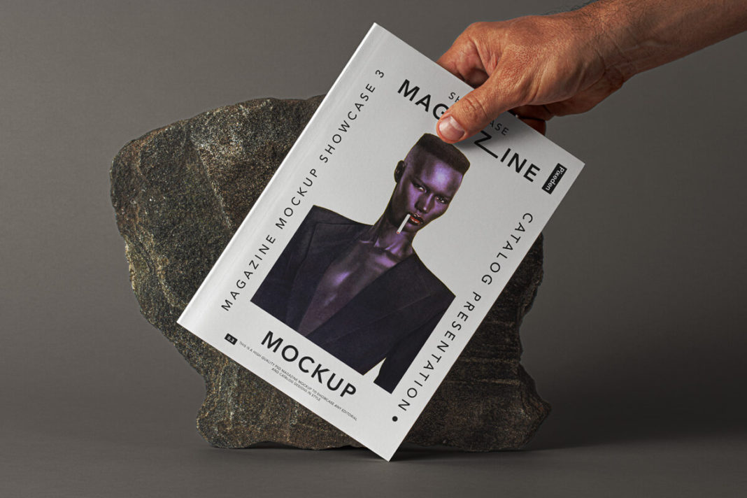 Hand Holding Magazine Mockup Free Download