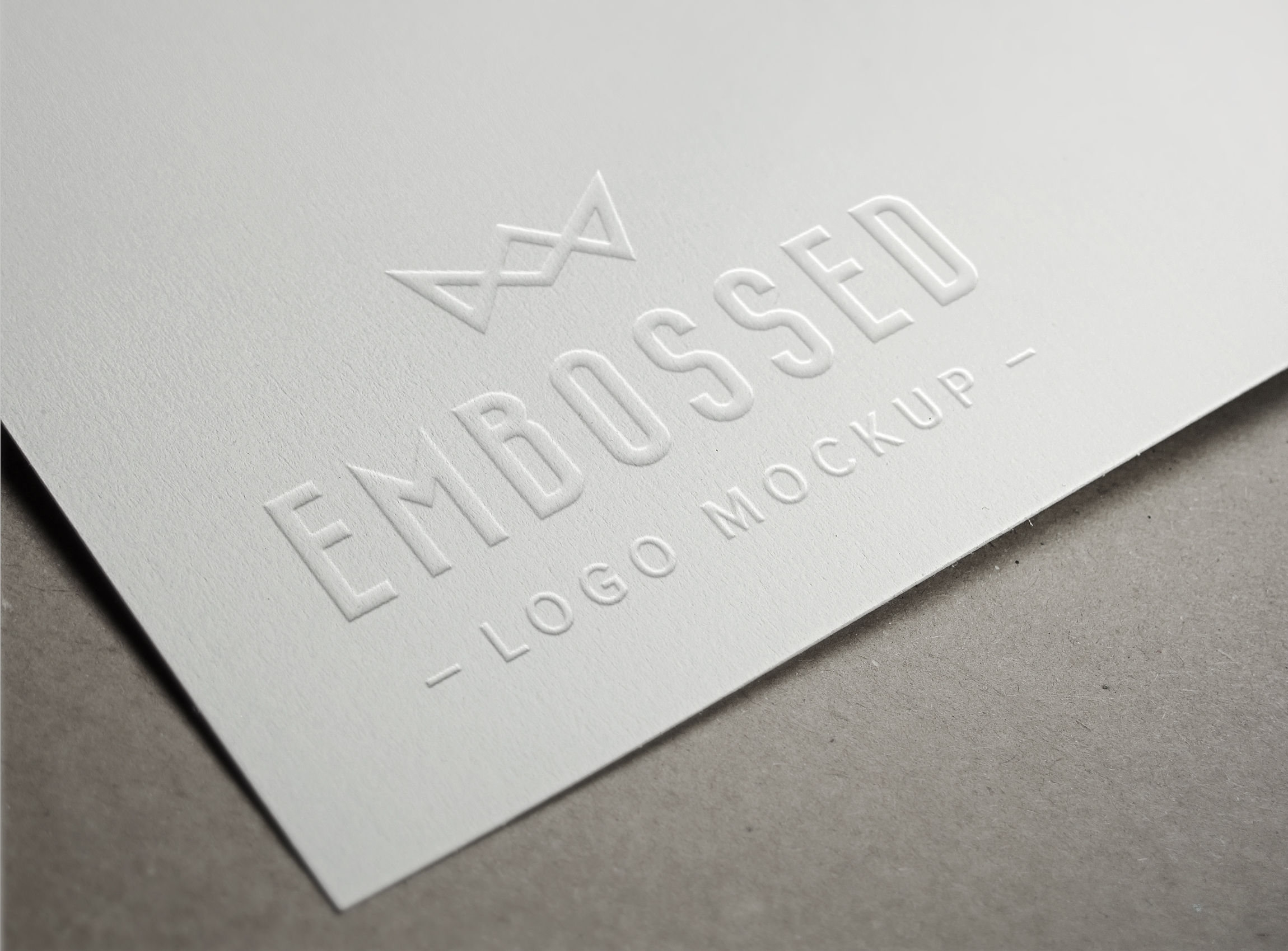 Embossed White Paper Logo PSD MockUp Free Download