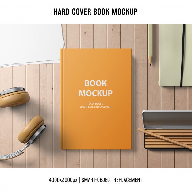 Hard cover book with headphones and pencils Mockup Free Download