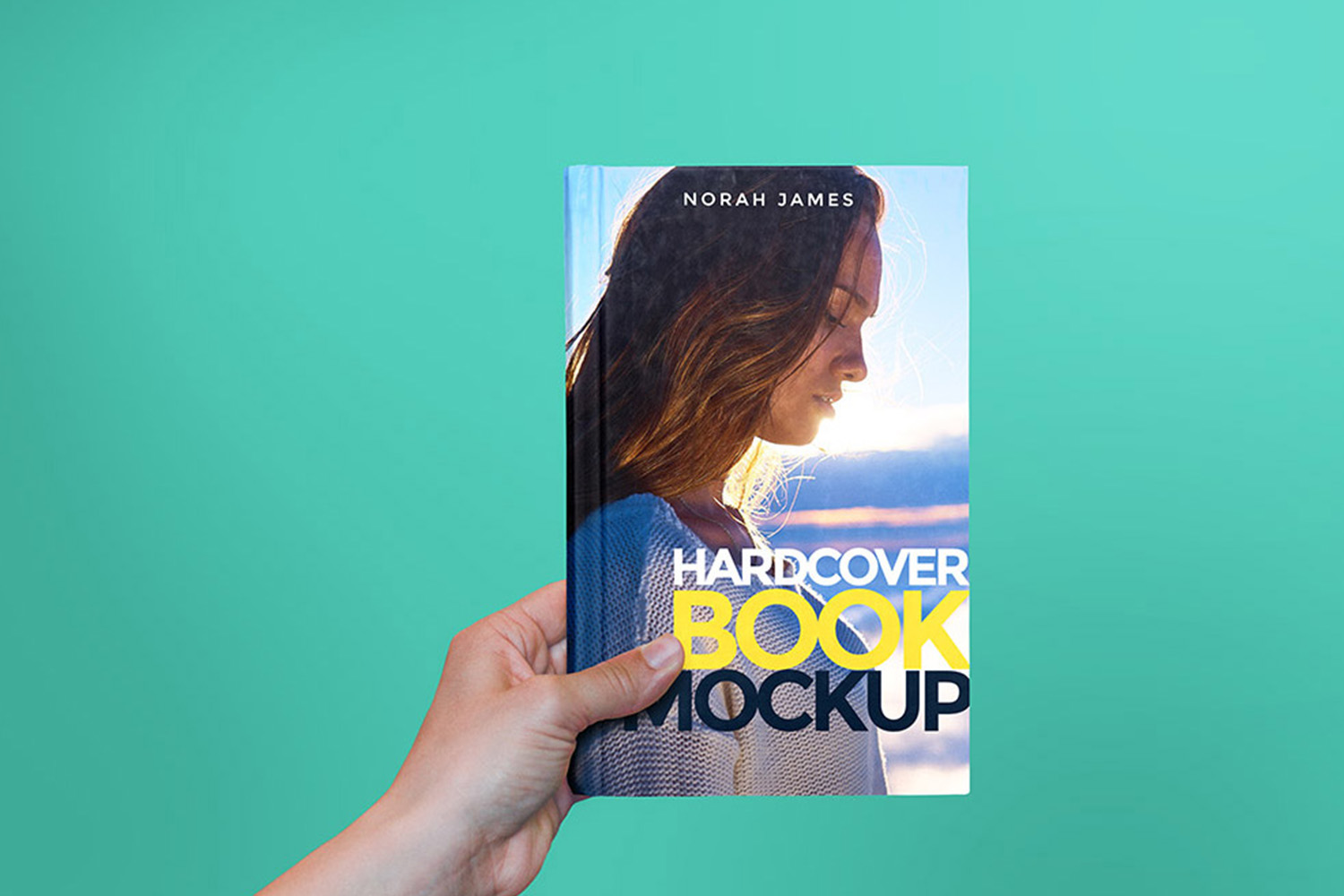 Hardcover Book in Hand Mockup Free Download
